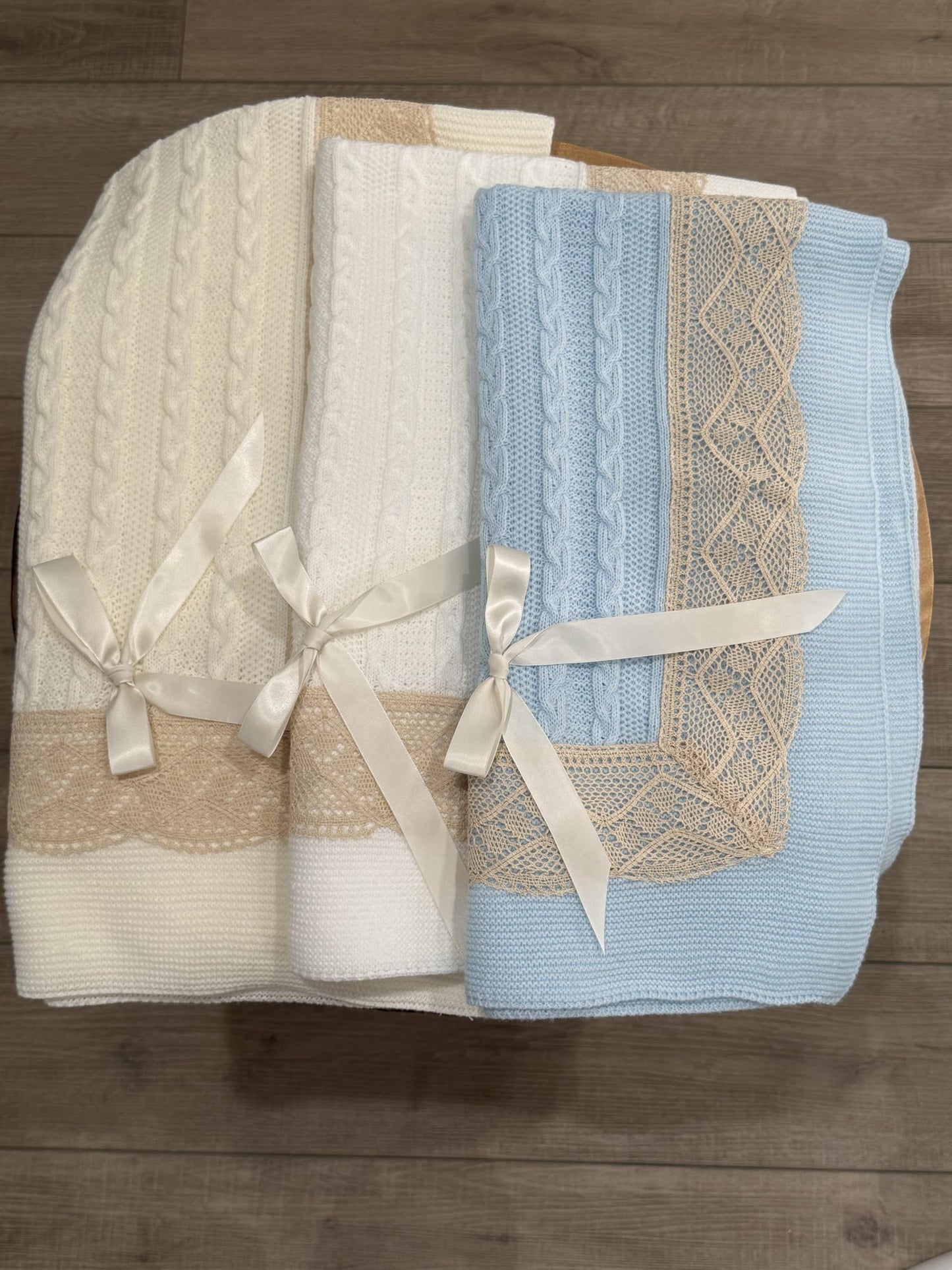 Elegant Knit Baby Blanket with Braided Design and Lace Trim