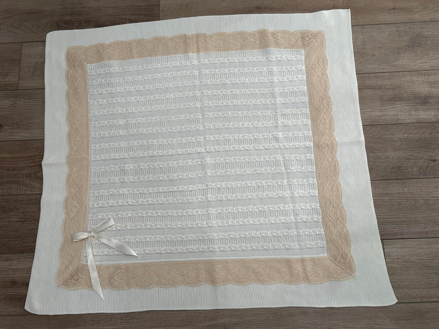 Elegant Knit Baby Blanket with Braided Design and Lace Trim