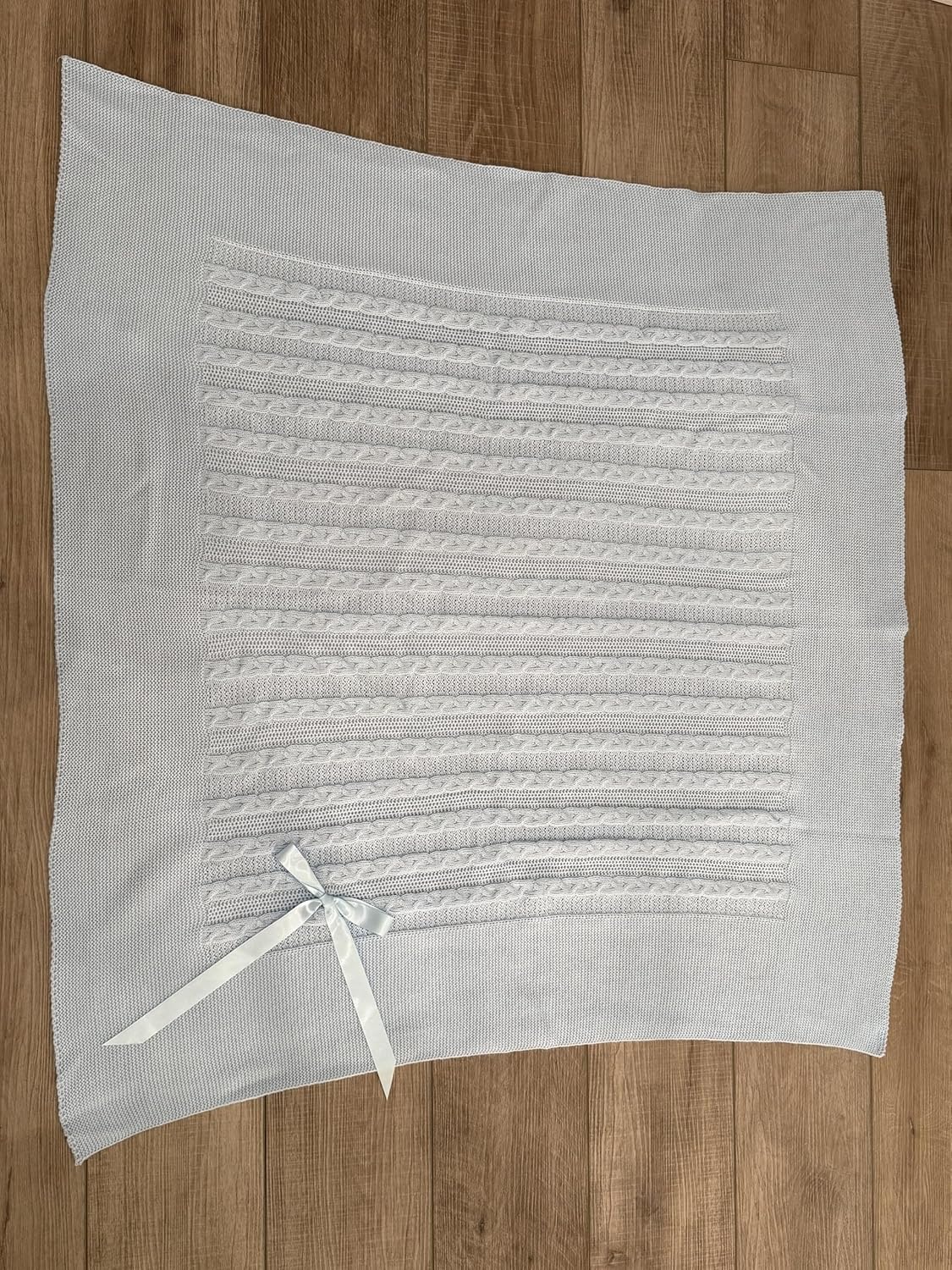 Soft Knit Baby Blanket with Braided Pattern and Bow